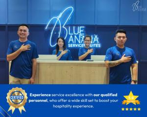 a group of people standing behind a desk at Arte Cheras by BlueBanana, Kuala Lumpur in Kuala Lumpur