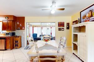 a kitchen and living room with a table and chairs at The Falcon's Nest in Venice