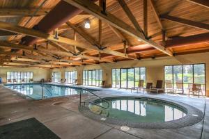a large indoor swimming pool in a building with windows at Eagle Crest home located on the Challenge Course in Redmond