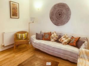 a living room with a couch and a chair at The Yellow House in Gorleston-on-Sea