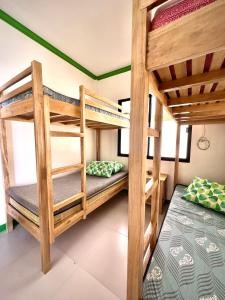 a bunk bed room with two bunk beds at NOGS Homestay, near Magpupungko, Siargao Island Surfings Spots in Pilar