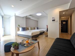 Postel nebo postele na pokoji v ubytování ESLEAD HOTEL Osaka Tsuruhashi