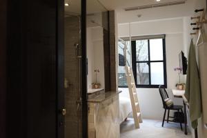 Voodi või voodid majutusasutuse NiHao Café Hotel toas