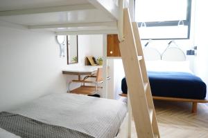 Voodi või voodid majutusasutuse NiHao Café Hotel toas