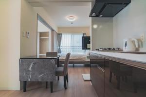 Kuchyň nebo kuchyňský kout v ubytování Star Residence - 博多上呉服