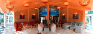 a living room with red furniture in a building at Hoàng Long Resort Villa in Xóm Chua Thanh