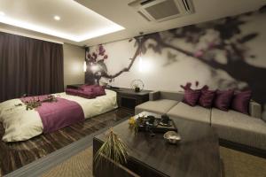 Ліжко або ліжка в номері Hotel Zen (Adult Only)