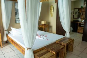 Postel nebo postele na pokoji v ubytování Hotel Ylang Ylang