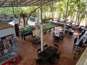 an overhead view of a patio with ping pong tables and chairs at Bohemiaz Resort and Spa Kampot in Kampot