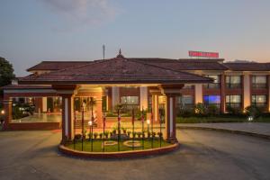 a hotel with a gazebo in front of a building at Hotel Pokhara Grande in Pokhara