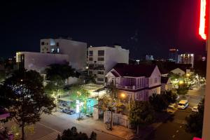a view of a city at night with lights at Thien Ha Hotel in Thu Dau Mot +10 photos