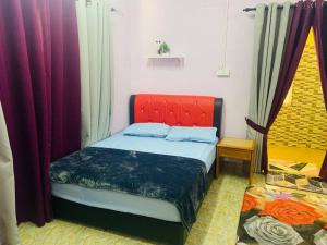 Krevet ili kreveti u jedinici u objektu Nabilah Homestay, Besut