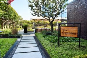 a sign for a garden with a sign for a table at JW Marriott Hotel Seoul in Seoul