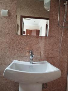 a white sink in a bathroom with a mirror at Sanahin OLD&NEW in Alaverdi