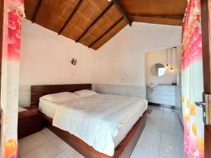Postel nebo postele na pokoji v ubytování Sembalun Kita Cottage