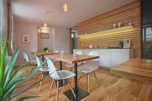 a kitchen and dining room with a table and chairs at Penzion Dobré Časy in Poděbrady