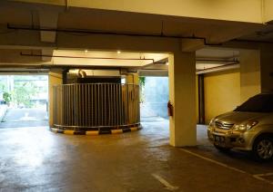 a parking garage with a car parked in it at World Hotel Jakarta - Bandengan in Jakarta