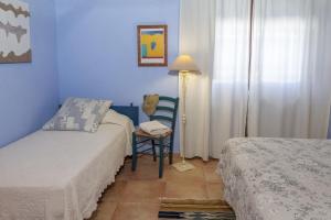 A bed or beds in a room at Casa Rural Can Coll