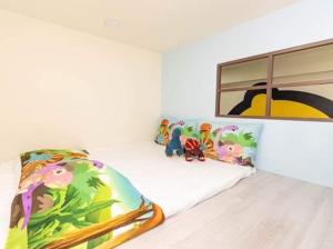 Łóżko lub łóżka w pokoju w obiekcie Haoyue Tongxin Family Homestay
