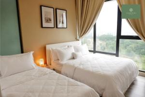 two white beds in a room with a window at Mosaic Southkey Johor Bahru in Johor Bahru +31 photos