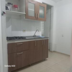 a kitchen with a sink and a counter top at APARTAMENTO 3 HABITACIONES 6 PERSONAS SIN AIRE ACONDICIONADO - ventilador MAS DE 3 NOCHES in Valledupar