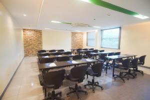 a conference room with tables and chairs in it at Go Hotels Bacolod in Bacolod