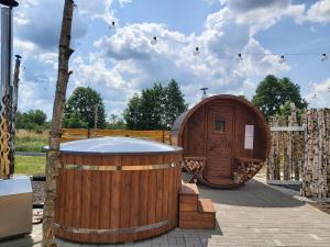 Fotografie z fotogalerie ubytování Drewniany Zakątek z sauną i jacuzzi v destinaci Jadów