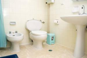 a bathroom with a toilet and a sink at Nafplio Relax Retreat in Nafplio