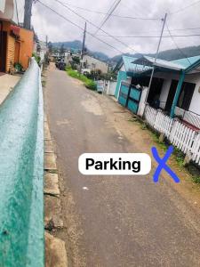 a street with a purple x on a fence at Rizi Bungalow In Nuwara Eliya in Nuwara Eliya