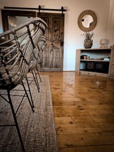 a room with a chair and a wooden floor at Country home Lagom in Zagorska Sela