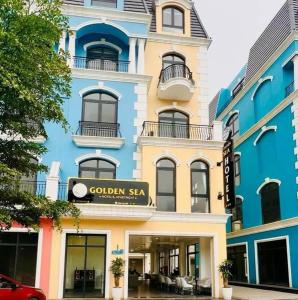 a colored building with a golden sea sign on it at GOLDEN SEA HOTEL *** in Ðố Sơn