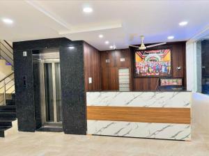 Postel nebo postele na pokoji v ubytování HOTEL DKR GRAND