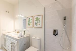 a bathroom with a shower and a toilet and a sink at Casa Rental home Campana in Seville +35 photos