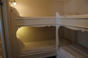 Postel nebo postele na pokoji v ubytování Olarsgården Hotell