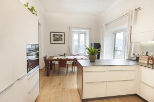 a kitchen and dining room with a dining table at Ferienwohnung Foller in Leutschach