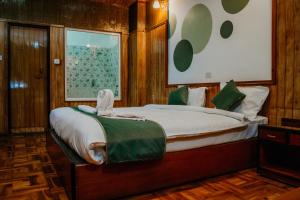 Postel nebo postele na pokoji v ubytování Tashi Palace