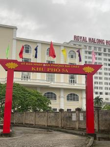 a red sign in front of a building at Hotel Me Kong 2 in Ha Long