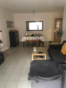 a living room with a couch and a table at Praia da rocha in Portimão