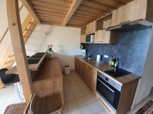 a small kitchen with a sink and a stove at Apartment Liscia sea view, restaurant and supermarket 50m in Calcatoggio
