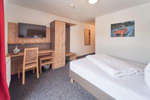 Postel nebo postele na pokoji v ubytování Hotel am Interpark
