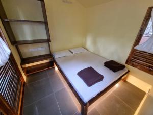 Een bed of bedden in een kamer bij Raan Guhagar