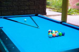a blue pool table with balls on it at Trang An Hometown Homestay in Ninh Binh