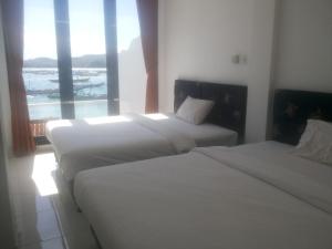 Postel nebo postele na pokoji v ubytování Spear Beach House