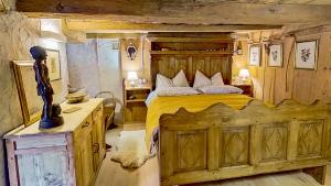 Posteľ alebo postele v izbe v ubytovaní Ca' Scocc, antica casa di montagna in Valsesia