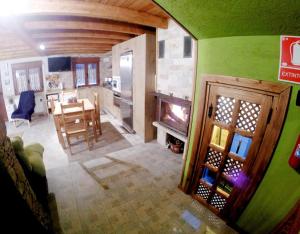 an overhead view of a living room and kitchen with a fireplace at Casa La Charca 