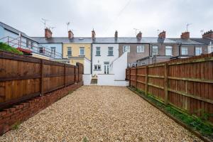 a row of houses behind a fence at Durham View by Tŷ SA in Newport