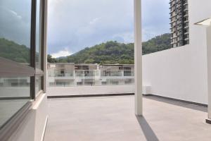 a balcony with a view of a building at 5BR 3Storey Cozy Gelugor Homestay 15pax in Gelugor