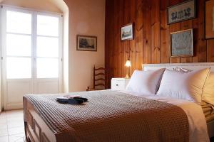 a bedroom with a bed with a plate on it at Hillside Villa over Lemonodasos in Galatas