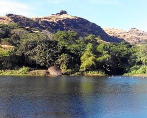 a body of water with trees and a mountain at Outback Retreat/Hotel, Ba Fiji in Tonge