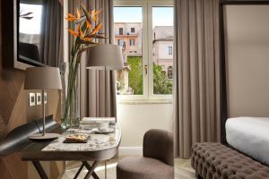Uma cama ou camas num quarto em FH55 Grand Hotel Palatino